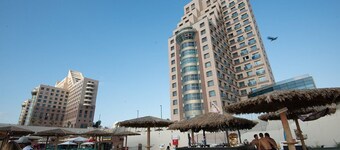 sea sun and fun on the mediterranean beach , restaurants and bars near by