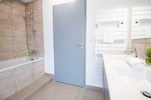 Shower, hair dryer, towels, soap