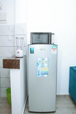 Deluxe Apartment | Private kitchen | Fridge, microwave, cookware/dishes/utensils - Lux Suites Casey's 1 Bedroom Apartments (Mombasa)