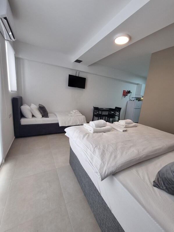 Basic Triple Room, Courtyard View | Egyptian cotton sheets, premium bedding, down duvets, memory-foam beds
