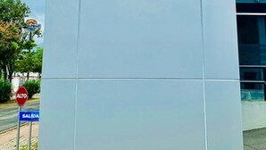 A sign for Intercity Tower Hotels with a blue logo and the hotel name. - Intercity Tower Hotels  (San Pedro Sula)