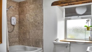 A bathroom with a bathtub, toilet, and a window with a view. - New House Farm - UKC6912 (Cowan Bridge, near Kirkby Lonsdale)