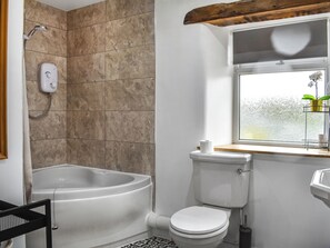A bathroom with a bathtub, toilet, and a window with a view. - New House Farm - UKC6912 (Cowan Bridge, near Kirkby Lonsdale)