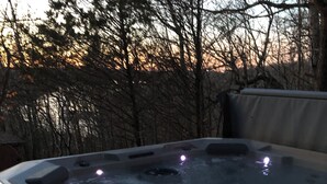 A hot tub with a control panel and a smartphone on the edge. - Royal View your holiday escape on Table Rock Lake near Branson Attractions. (Lampe)