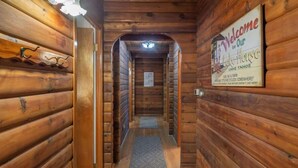 A wooden hallway with a welcome sign for Lake Tahoe Lodge. - Zoss Cabin (Carnelian Bay)