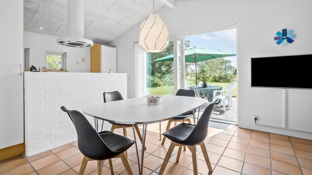 A modern kitchen with white cabinetry, a built-in oven, and a large window. - Lovely home in Hurup Thy with WiFi (Hurup Thy)