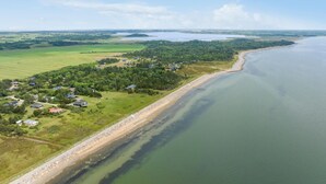 An aerial view of a coastal area with houses along the shore, a sandy beach, and a large body of water. - Lovely home in Hurup Thy with WiFi (Hurup Thy)