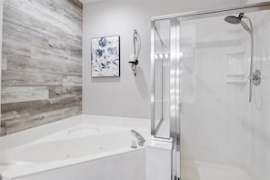Shower, jetted tub, towels