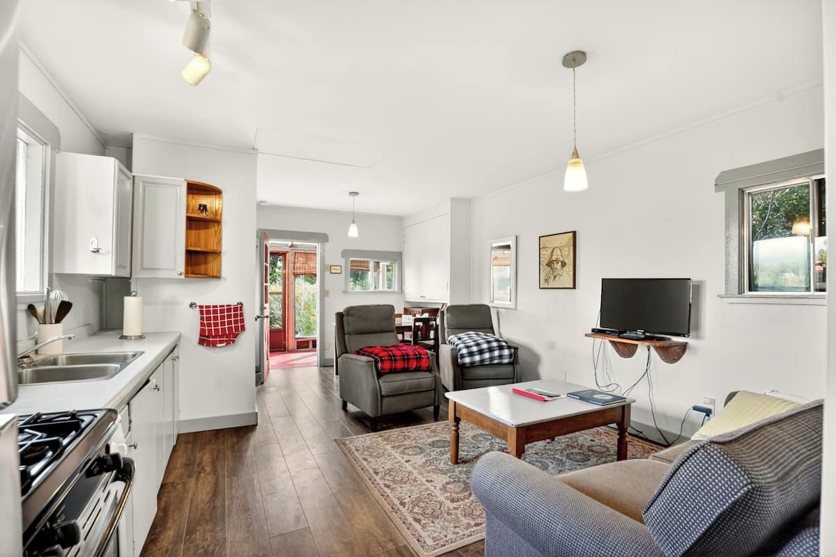 Comfort Cabin, Balcony | Living area | 42-inch flat-screen TV with satellite channels