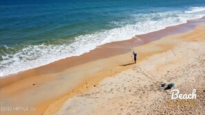 A beach with a person fishing, clear skies, and calm sea. - Palm Coast, FL/Sea Colony house

 (Palm Coast)