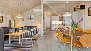 A modern interior with a dining area, kitchen, and living space. - Stunning home in Tranekær with sauna (Tranekær)