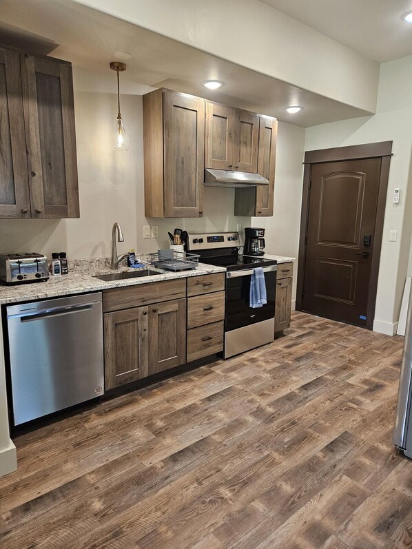 Fridge, stovetop, cookware/dishes/utensils, dining tables