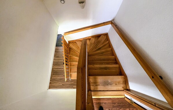 Stunning staircase with a modern design, featuring a combination of straight and curved elements.