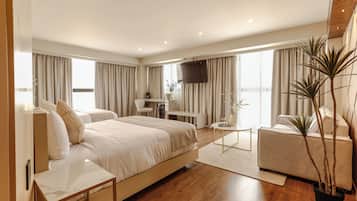 Habitación doble Deluxe | Ropa de cama de alta calidad y caja de seguridad en la habitación