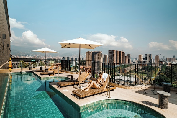 Outdoor pool, open 9:00 AM to 8:00 PM, pool umbrellas, sun loungers