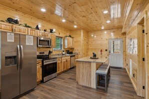 Fridge, microwave, oven, stovetop - On Blackbeary Hill: A cozy 3-BR cabin perfect for a getaway in an enchanting forest setting. (Pigeon Forge)