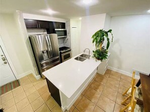Fridge, paper towels - Furnished, Remodeled Condo in Cute Travis Heights Complex Steps from Downtown (Austin)