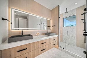 Shower, hair dryer, towels, shampoo
