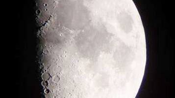 A full moon with visible craters and maria.