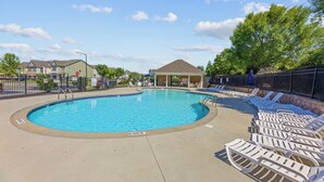 A swimming pool with lounge chairs and a gazebo. - Where Relaxation Meets Home, KING Suite RETREAT, 14 MINS to RDU Airport, POOL (Morrisville)