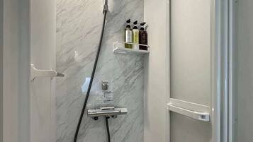 Shower, hair dryer, towels, soap