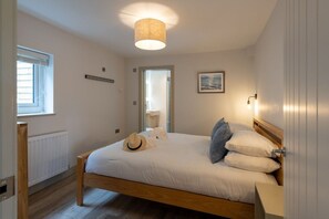 Bedroom with estuary views, one of four bedrooms at this pet-friendly home in Aberffraw, Anglesey