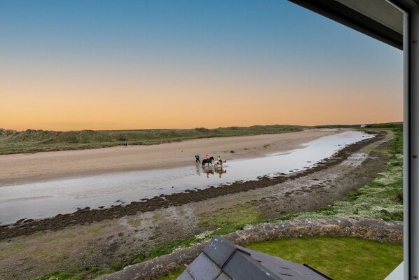 Views over the Aberffraw estuary, direct beach access from this pet-friendly home in Aberffraw, Anglesey