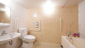 A bathroom with a sink, toilet, and bathtub.