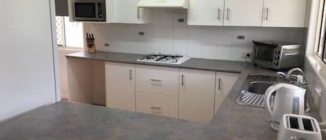 Apartment, Multiple Beds | Private kitchen