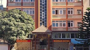 A multi-story hotel with balconies, a central entrance, and signage for 'Charming Durban Hotel'. - Charming Durbar Hotel  (Kathmandu)