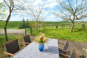 Enjoy a romantic meal for two in this serene outdoor setting with a beautiful view.