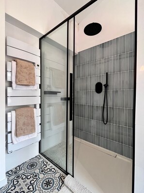 Shower, hair dryer, towels, soap