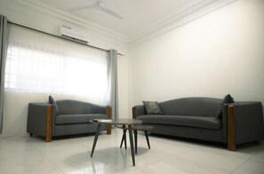 Luxury Apartment | Living area | Flat-screen TV