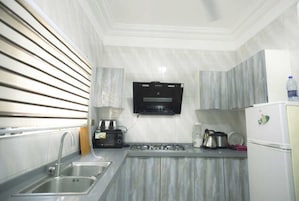 Luxury Apartment | Private kitchen | Full-size fridge, microwave, stovetop, dishwasher