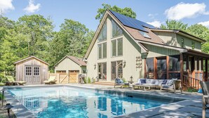 A house with a swimming pool, large windows, and a garage. - Cold Spring Mountain Retreat: Secluded Oasis (Cold Spring)