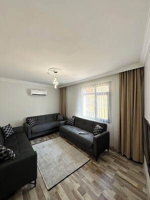 Appartement familial | Aire de séjour | Téléviseur à écran plat, lecteur de DVD