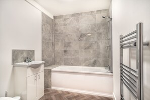 Shower, hair dryer, towels, shampoo