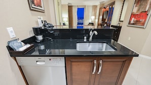 A modern kitchen with a Bosch dishwasher, a coffee machine, and a sink. - 1BD/2BA • Balcony • No Resort Fee • Free Parking E24I2 (Las Vegas)