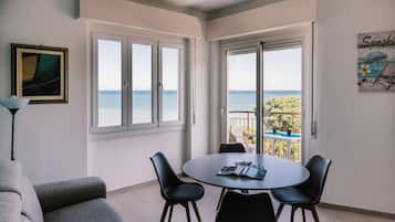 Apartment (1 Bedroom) | Living area | 55-inch TV with cable channels