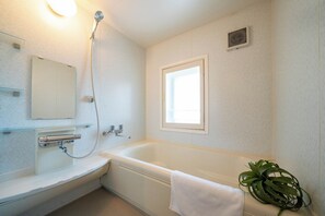 Family Room | Bathroom | Separate tub and shower, slippers, towels, toilet paper