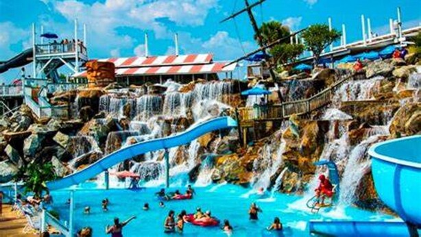 A water park with multiple slides and a pool area. - Seawinds 9 | Renovated Gulf-Front Escape (Mramar Beach)