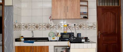 Family Apartment, City View | Private kitchen | Fridge, microwave, cookware/dishes/utensils