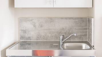 Fridge, microwave, cookware/dishes/utensils