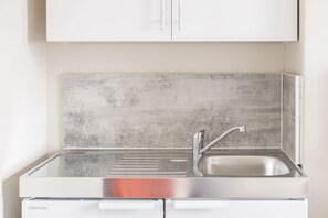 Fridge, microwave, electric kettle, cookware/dishes/utensils