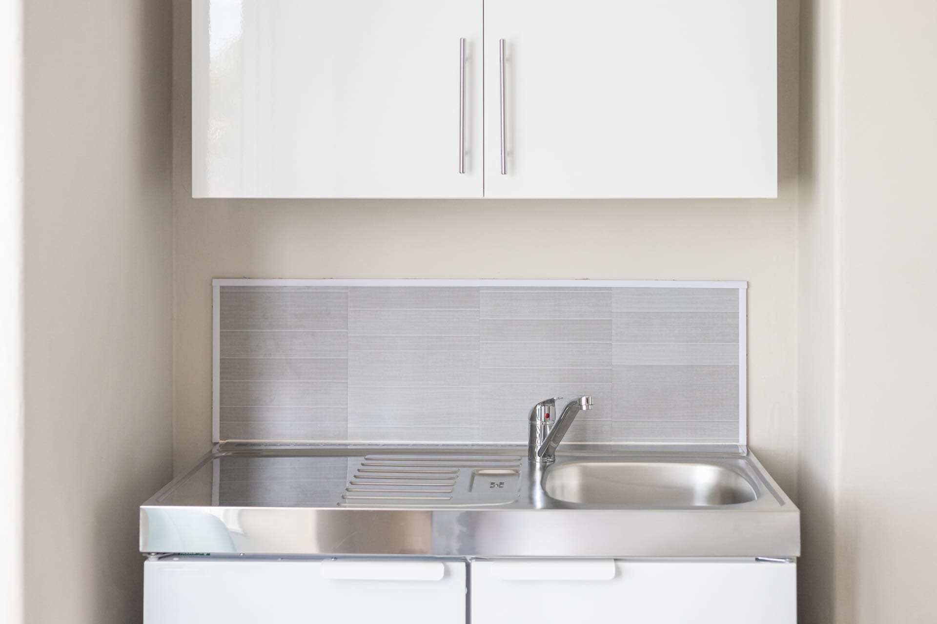 Fridge, microwave, electric kettle, cookware/dishes/utensils