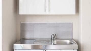 Fridge, microwave, electric kettle, cookware/dishes/utensils