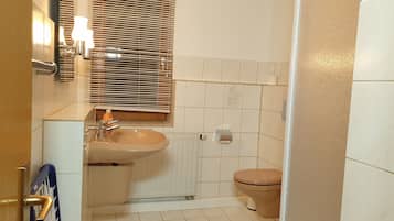 Shower, hair dryer, towels, toilet paper