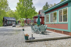 A patio area with outdoor seating and a gravel path.