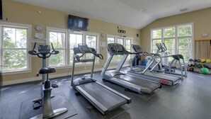 A gym with treadmills, stationary bikes, and exercise balls. - Summer Village Family Cottage w/ Community Perks! (Westford)