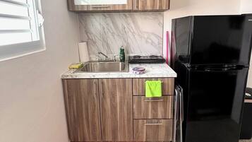 Fridge, microwave, stovetop, coffee/tea maker